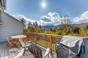Back deck accessed from main level living area for extra dining and outdoor grill provided.