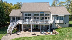 Amazing home with large elevated deck, covered patio and screened-in porch.