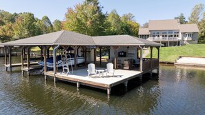 Amazing boathouse with sundeck, covered lounge, bar area with TV. 