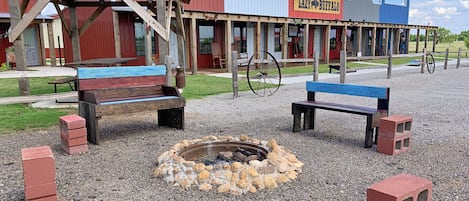 gather around the fire at The Lazy Buffalo