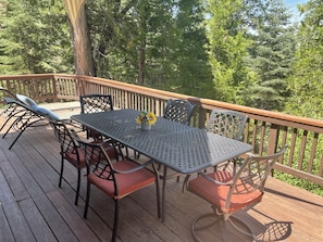 Large dining table on the main deck w/peaceful forest setting!Two other decks!