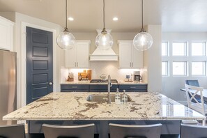 Kitchen Island - The Kitchen Island comfortably seats 4 adults and creates a great space for serving and preparing meals.