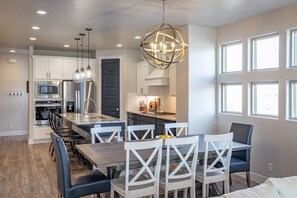 Dining Room - With an open and spacious floor plan, the Dining Room and Kitchen can accommodate meal preparations for groups large or small.