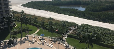 View Pool and Beach from lanai. Beautiful  walk on white sand to the water.