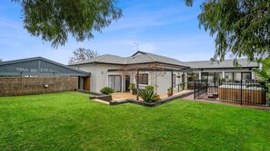 Backyard with spa and pizza oven 