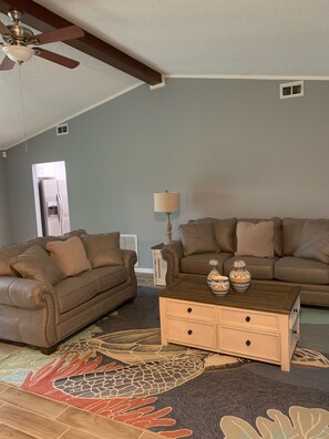 Living room with real leather couche, love seat coffee table, two ends table 