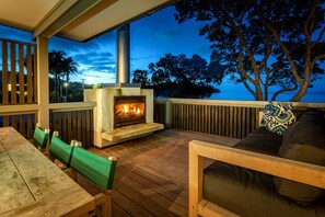 Outdoor fireplace on the Deck facing the sea