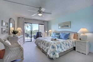 Spacious master with King size bed and slider leading out to the screened balcony...open the doors and let the fresh sea breezes awaken your senses!