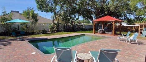 Pool and Patio Oasis with Pergola Seating