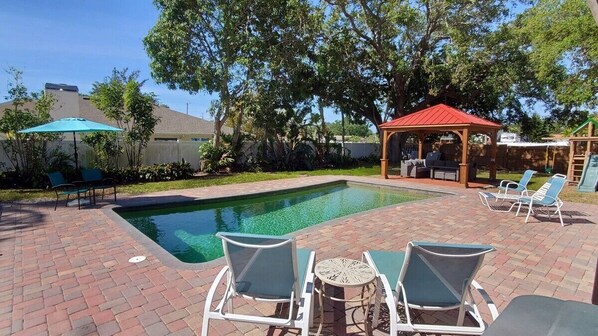 Pool and Patio Oasis with Pergola Seating