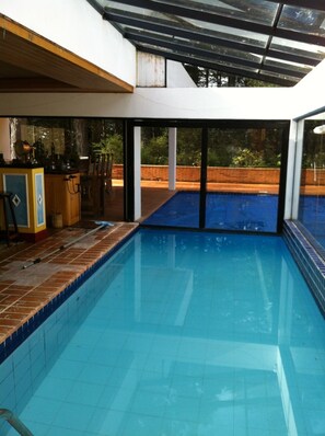 swimming pool view from inside the pavilion