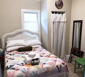 Guest room with full bed and breakfast in the Crooked House Gentry AR