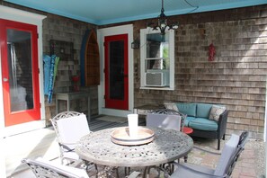 Your own private outdoor covered porch with seating.  Bedroom and entry doors.