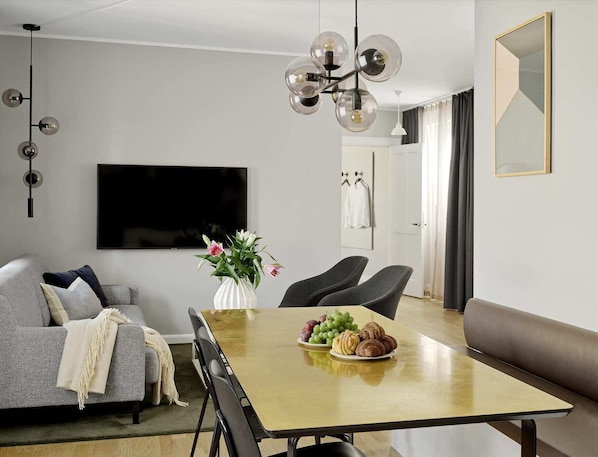 Spacious and bright living room with a comfortable sofa bed.