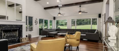 Beautiful Living Room with custom leather sofa that seats up to 20 guests. 