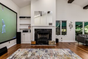 Fireplace in the main living room with well appointed designer finishes !