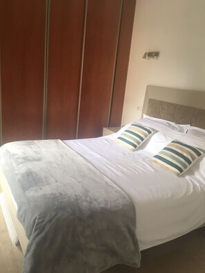 Master bedroom with king size bed and ensuite bathroom