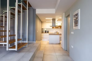 stairs and part of kitchen