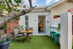 Patio. Cafe seating up to 4 guests. Bar counter seating up to 2 guests