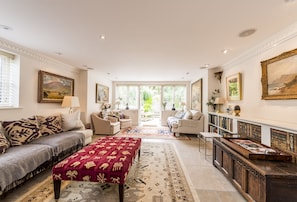 Ground floor: Sitting room with the television cleverly hidden away