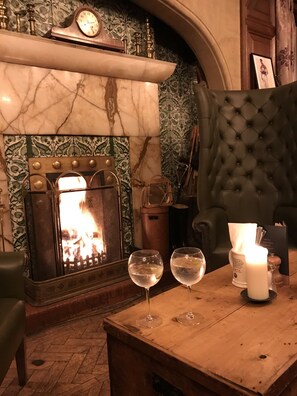 A cosy evening drink by the open fire at a local Hotel 