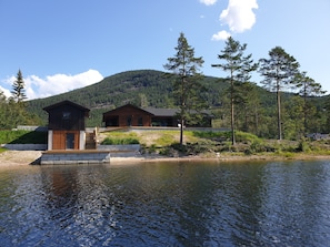 Lakeside bungalow with   private beach and jetty.