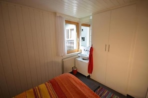 Sleeping room Nr. 1 with washbasin and built-in wardrobe