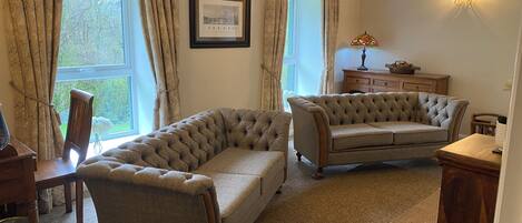 Harris Tweed and leather sofa's . Facing our 55 inch Samsung the Frame TV  