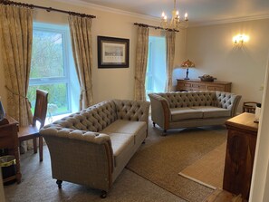 Harris Tweed and leather sofa's . Facing our 55 inch Samsung the Frame TV  