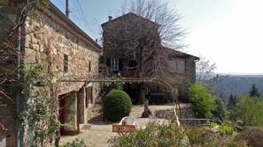 Terrace in front of the Summer Kitchen (left) and Main House (background)