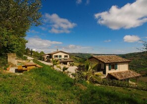 View from the olives-grove to the houses and arbecue