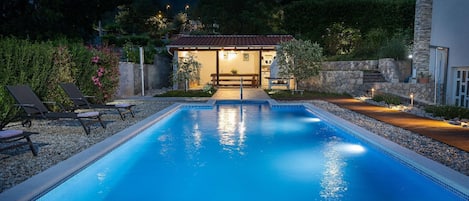 illuminated exterior area and pool