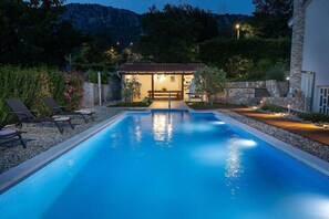 illuminated exterior area and pool