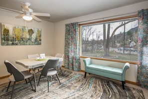 Dining room seats four and has a big picture window to let in lots of light.