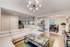 View of dining room, kitchen, and den from living room.