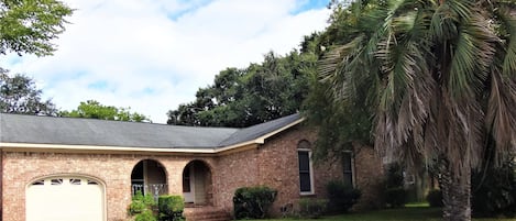 Spanish architecture brick house. Expanded driveway for parking