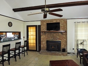 living room with cathedral ceilings, TV, fireplace; smart HD TVs in every bdrm