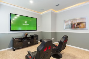 80" TV with ceiling surround sound with sub woofer. XBox one and Play station 4