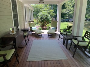 The front porch is perfect for morning coffee, evening drinks and all in between