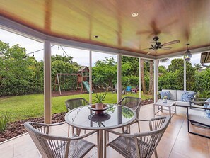 Screened Lanai looking onto Playground and Fire pit