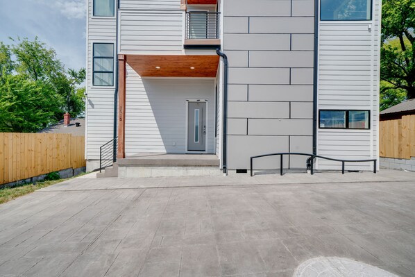 Property entrance with driveway ( 4 -5 car ) accessible through alley