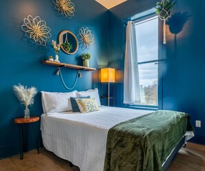 Queen bed, TV, nightstand, and closet with an extra dash of style and comfort