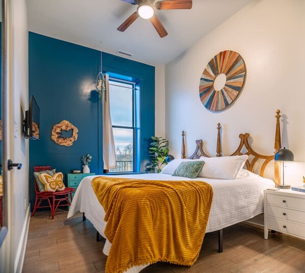 Relax in king-size comfort with crisp sheets and soft lighting.