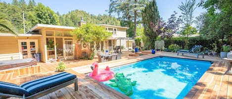 1200 square foot deck with pool and hot tub