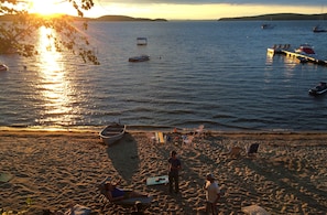 Large sandy beach with gentle grade into the water.