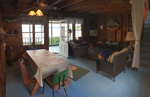Main living area with door to the large lake-facing screened in porch.