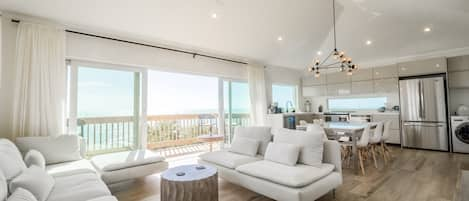 Open plan living/dining. 16 ft slider leading out to unobstructed ocean views.  