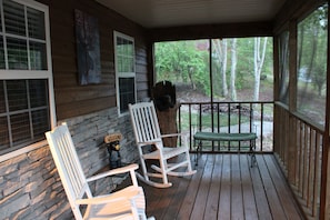 Sit down and relax on the screened-in front porch. You will LOVE it!