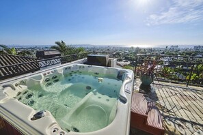 There is an additional jacuzzi on the rooftop to get an amazing aerial view of the neighborhood and the ocean in the distance.