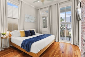 Bedroom 2 with king bed and natural lighting and spacious closet